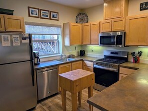 Fully equipped kitchen with all of the utensils you need to make a delicious meal during your stay