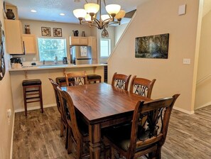 Large wood dining table with seating for 6