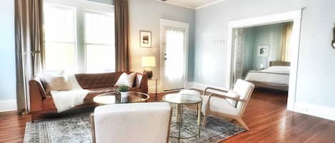 Living Room with Top Grain Leather Sofa, side chairs, 48" Smart TV