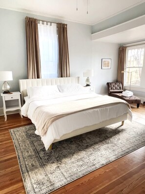 Back Bedroom Featuring Plush King Bed and Luxury Bedding, and Reading Nook with Chaise Lounge