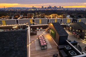 Experience Nashville’s vibrant energy from this stunning rooftop oasis, perfect for large groups. Enjoy luxurious seating, skyline views, and a chic dining area—ideal for your next bachelorette party or family reunion. Make this your exclusive vacation rental and let the good times roll!
