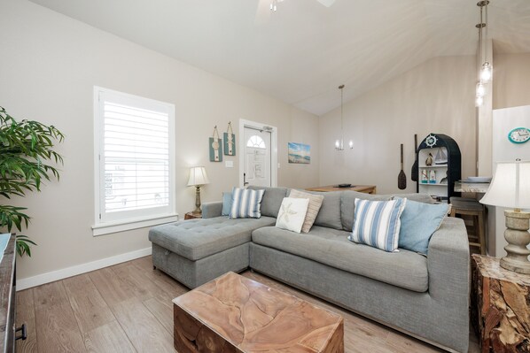 Charming living area featuring a cozy sofa, perfect for relaxing