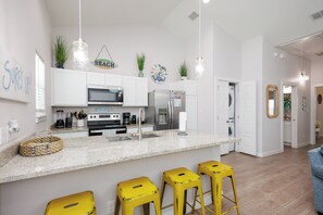 Bright kitchen Island with four barstools, perfect for entertaining