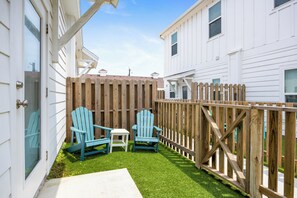 Private turf patio off of the master bedroom