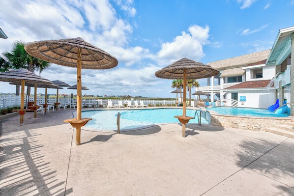 The sparkling Aruba Bay Resort pool overlooks the canal, offering a picturesque backdrop