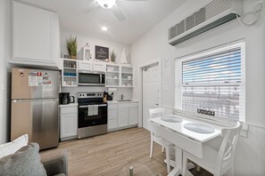 Kitchen and dining area with seating for two