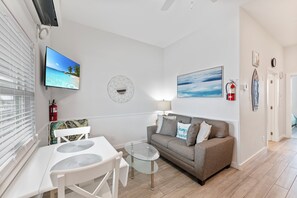 Beautiful living area with twin sleeper sofa and flat screen TV