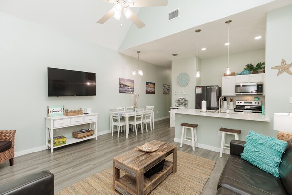 Versatile living area featuring a harmonious blend of comfort and style, ideal for both relaxation and entertaining