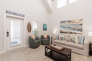 Open concept living area with relaxed seating and queen size sleeper sofa