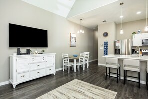 Living area looks into kitchen and dining room for plenty of space