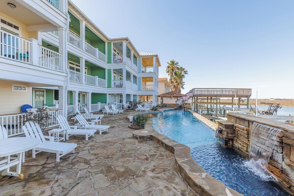 Large pool with lounge chairs nearby