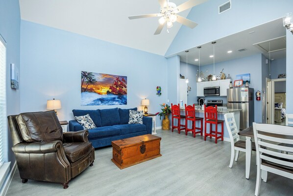 Bright living area with queen size sleeper sofa and flat screen TV