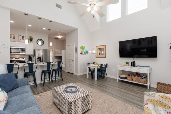 Living area with queen sized sleeper sofa and flat screen TV