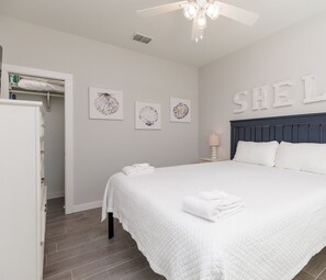 Downstairs bedroom with queen size bed and flat screen TV