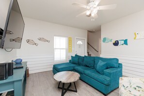 Living area with queen size sleeper sofa and large flat screen TV