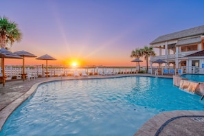 Soak up amazing water views from the poolside lounge seating