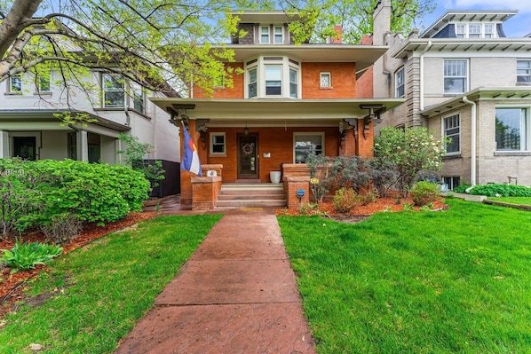 Front of house, entrance to left