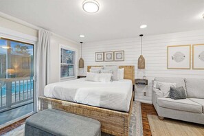 A cozy retreat with soft linens and modern furnishings.
