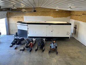Plenty of room for your snow mobiles in our covered garage! 