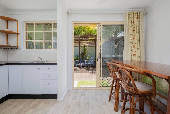 Sliding doors in the dining and kitchen area extend to the spacious back patio with ample space for your furry friend.