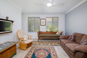 The character-filled living area is styled with vintage furnishings.