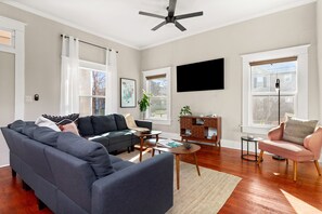 Cozy corners and inviting spaces, where laughter echoes and memories unfold. This living room is the heart of home, where comfort meets connection.