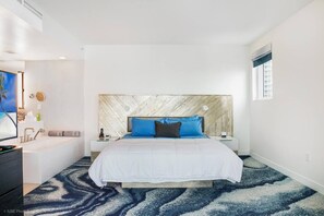 King Size bed with built in lights and plugs. Portable bluetooth speaker
