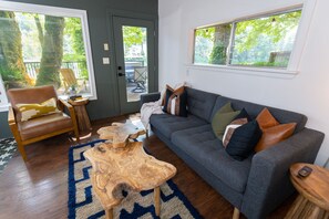 Cozy, Mid-Century Modern Family room with wood stove and views of the river