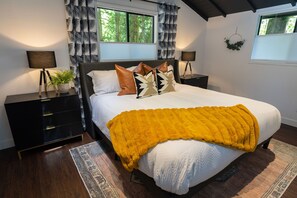 Stylish and Cozy Main Bedroom with King Bed and direct access to the bathroom