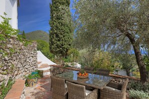 Dining outside with a view and mature gardens