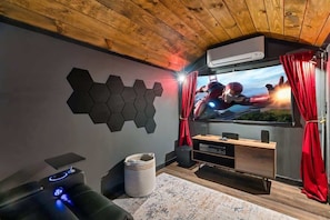 72" projector screen in a barn turned private theater for movie nights! Complete with movie theater quality reclining leather chairs, surround sound, heat/ac, and more!