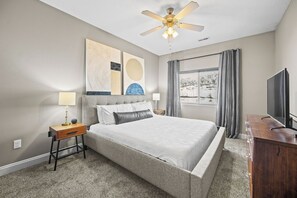 The primary bedroom has an AMAZING Tempurpedic king-sized mattress, room darkening curtains, smart TV and more!