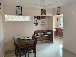 living room with tea or coffe maker, tea bag , towels, etc