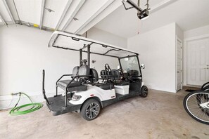 Enjoy convenient transportation with a golf cart and bicycles stored in the garage.