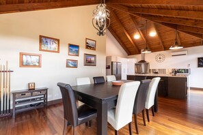 Dining table seats 8 then there are an additional bar stools at the kitchen counter for additional guests to sit and share a meal.