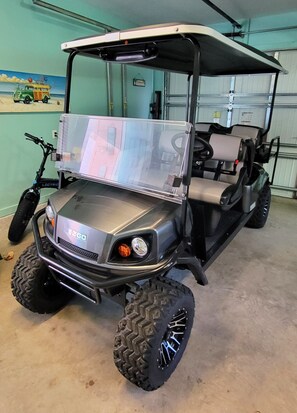 Pink Flamingo has a golf cart available to rent.  Ask about seasonal pricing.