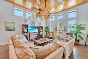 The spacious living room offers cable television and wireless internet.