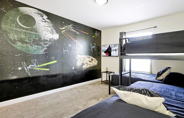 At the Star Wars bedroom, you will find a bunk bed with trundle for 4 kids