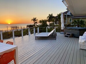 Sunrise from the deck - View from deck - hottub, 4 loungers, xlarge umbrella & dining table.