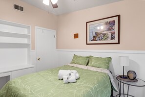 Drift into a world of comfort and elegance in this chic bedroom space