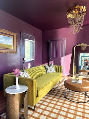 The Parlor- Perfect for a cozy conversation! Features an ADA half bath with a full washer/dryer, and a full bonus bath to be used by your guests. And yes, it has THE Anthro mirror!