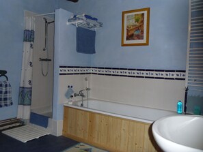 Bathroom with seperate show in the room. 
