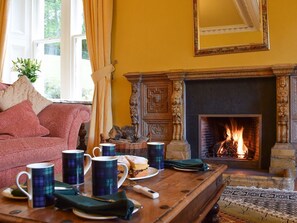 Sumptuous living room with open fireplace | Creag-Ard House, Aberfoyle