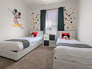 Mickey Mouse welcomes you at the third bedroom with two twin beds, at the ground floor