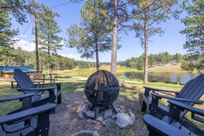 Experience the charm of the great outdoors with our cozy firepit setting.