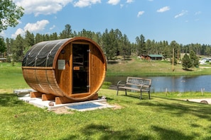 Unwind in the sauna, with nature's beauty just outside, creating a tranquil escape from the everyday hustle and bustle