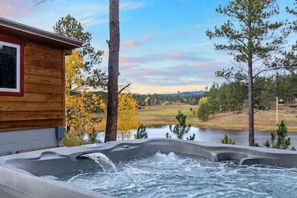 Immerse yourself in the warmth of our bubbling hot tub, surrounded by the beauty of the Black Hills