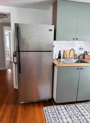 Kitchenette, equiped with cooking supplies.