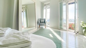 Awaken to serene elegance in our light-filled bedroom, a tranquil haven for ultimate relaxation.