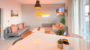 Experience the chic sophistication of our open-plan living and dining space, designed for contemporary comfort and style.